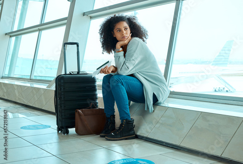 Airport, travel delay and depressed woman sad for immigration, passport or schedule problem. Young USA person with luggage and stress, anxiety or thinking of flight fail, crisis or identity mistake