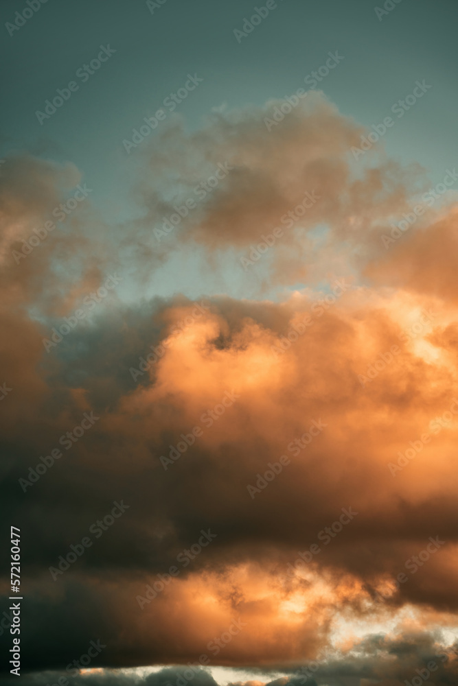 Cumulus sunset clouds with the sun setting down. Amazing sky summer evening background. Cumulus sunset clouds with the sun setting down. Amazing sky summer evening background.