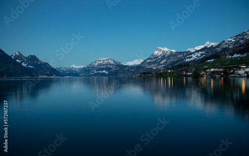 Alpine lake at dusk with Swiss Alps in the background © Mauro´s Corner
