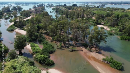 Drone footage above Koh Han island a beautiful gem in the Mekong River, Stung Treng province, Cambodia, amazing flooded forest and sand 