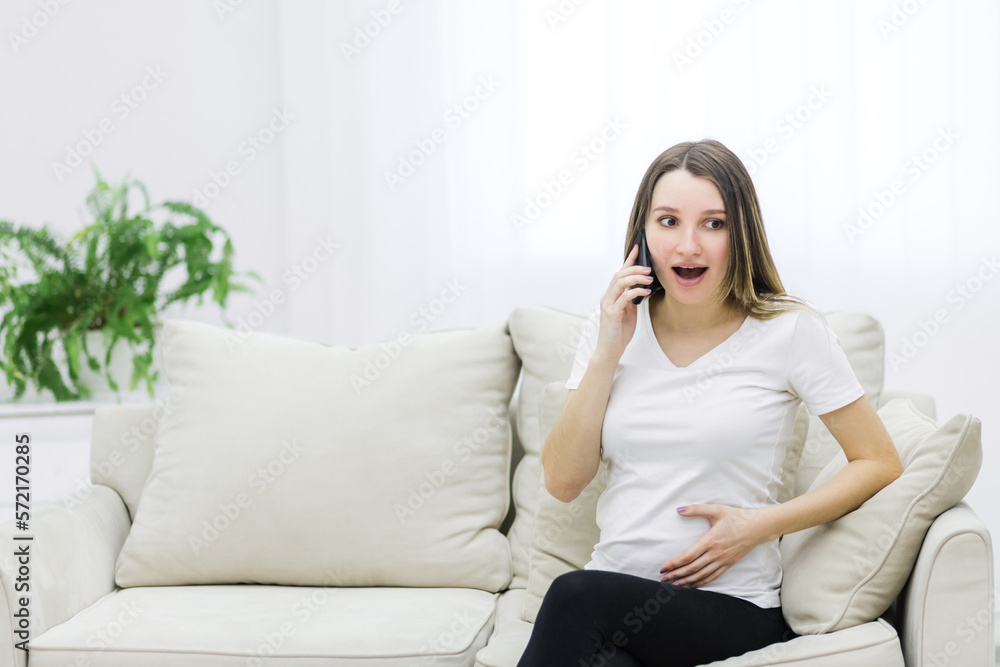 Photo of pregnant woman talking over the phone. Photo of pregnant woman talking over the phone.