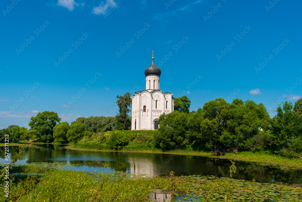 View of Church of the Intercession on the Nerl on summer day. Temple in the Vladimir region of Russia, built in the 12th century.