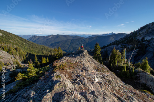 Hiker girl revels in majestic Alpine Lakes Wilderness in Washington