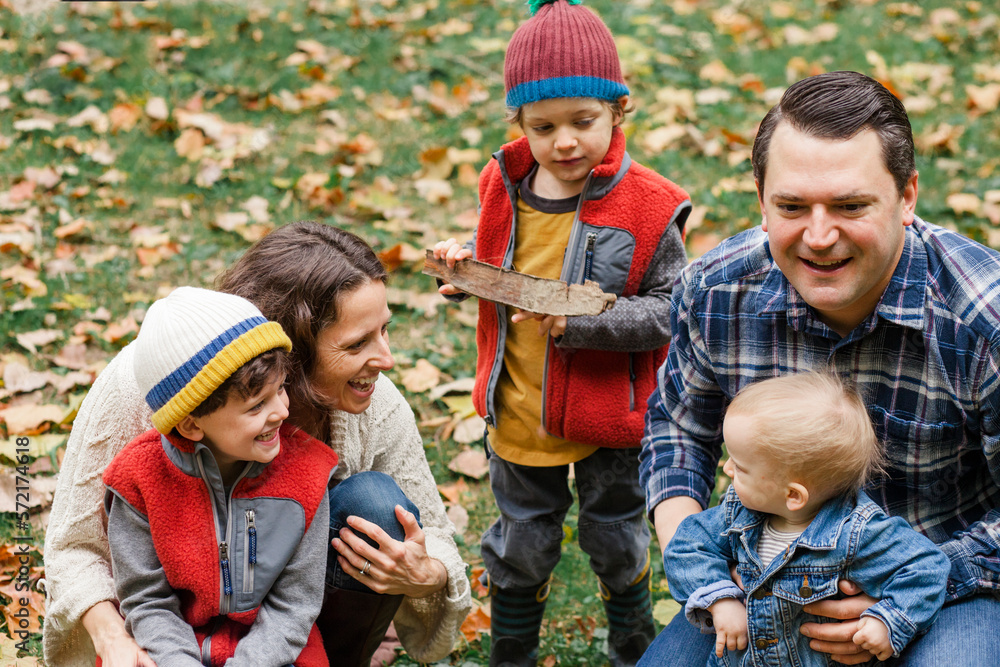 a happy family play together in a grassy lawn a happy family play together in a grassy lawn