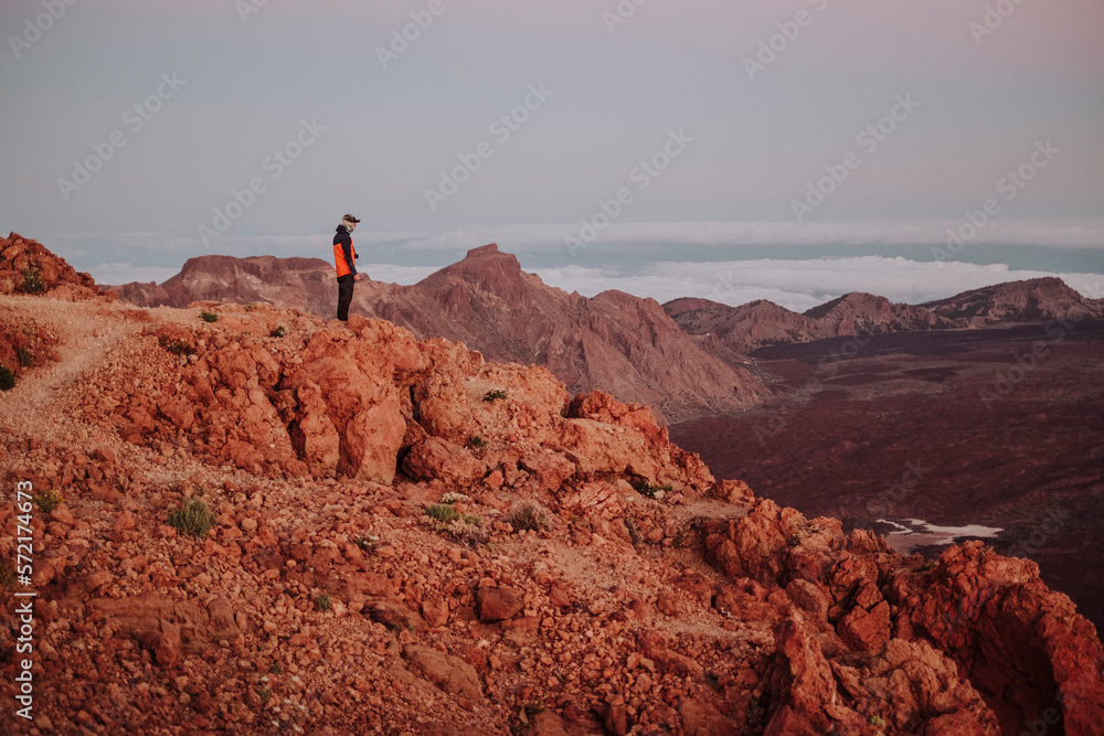 Hiker at sunrise in the top of Guajara Mountain, Tenerife Hiker at sunrise in the top of Guajara Mountain, Tenerife