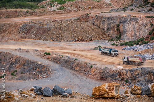dumb trucks working at gravel mine in Thailand
