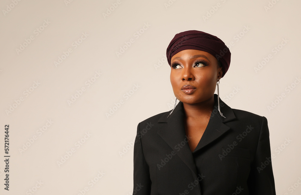 Close-up of thouthful muslim young woman wearing hijab posing indoor. Vertical. Close-up of thouthful muslim young woman wearing hijab posing indoor. Vertical.