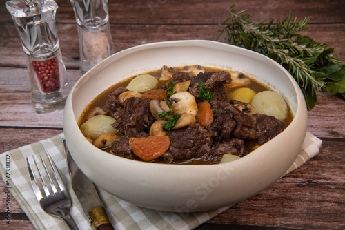 Beef bourguignon recipe, beef stew with wine sauce and vegetables. High quality photo
