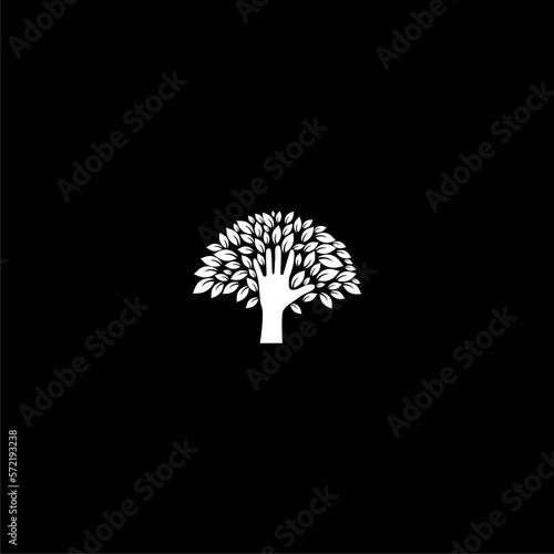 Human hand and tree with leaves icon isolated on dark background © sljubisa
