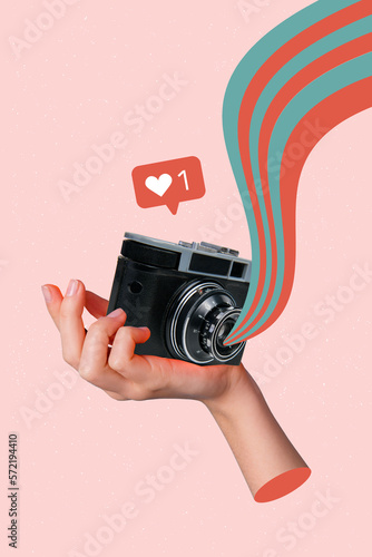 Vertical photo artwork design collage hand holding vintage photocamera shooting cadre popular picture online media isolated on beige color background photo