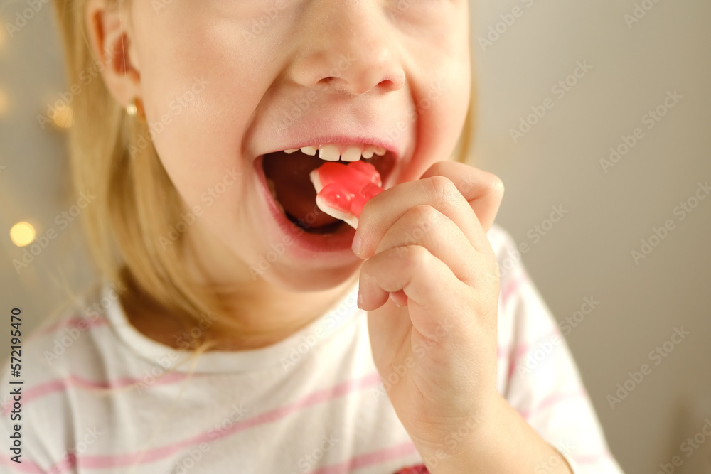 portrait of small child, blonde girl 3 years old wants to eat