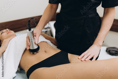 Cosmetologist. Lymphatic drainage massage LPG apparatus process. Woman getting massage in a beauty SPA salon. LPG, and body contouring treatment in clinic.