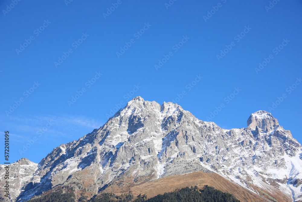 Picturesque view of beautiful high mountain under blue sky on sunny day