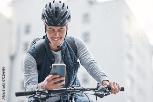 Search, bike or man travel with phone in London city, street or road for GPS, location or networking outdoor. Smile, happy or male smile with smartphone or communication, social media or 5g network