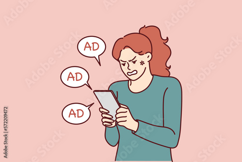 Woman is angry after receiving another promotional message from store using spam to attract new customers. Girl with tablet is nervous because of spam preventing from playing game or reading article 