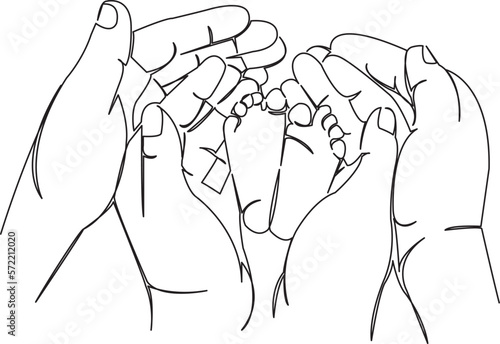 newborn's legs in the hands of mom and dad