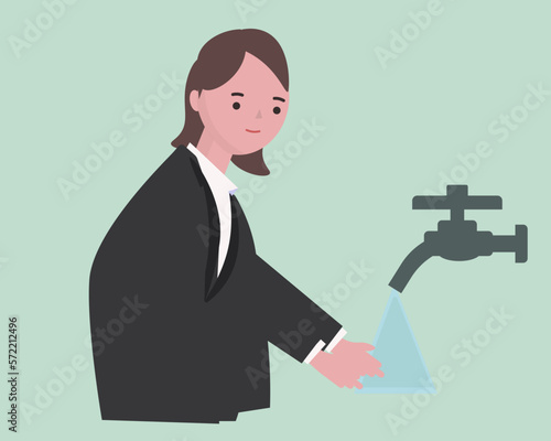 手洗いをするビジネスウーマン。手を洗う スーツ姿の女性 感染予防 水道