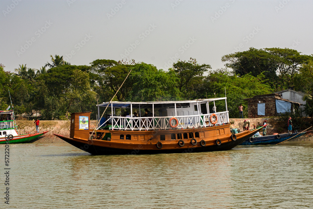 11th February, 2023, Sundarban, West Bengal, India: Few tourist boats anchored on the bank of river at Sundarban Tiger reserve, India.