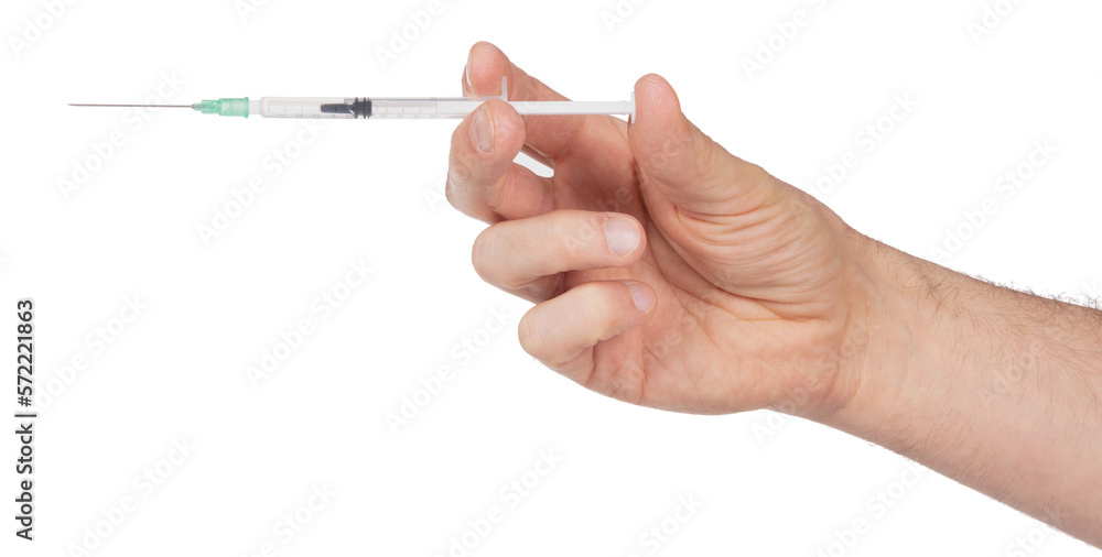 New syringe in adult hand on white background New syringe in adult hand on white background