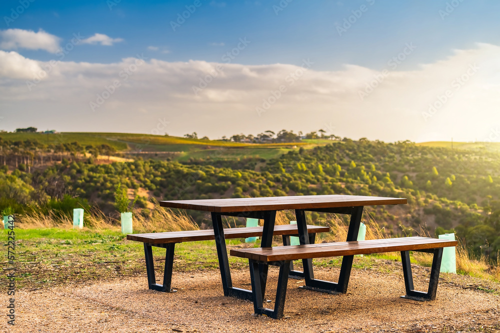 Public picnic table with McLaren Vale vineyards in the background at sunset, South Australia