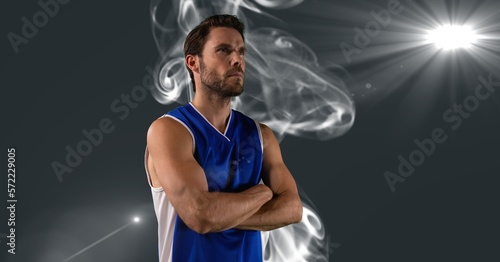 Composition of male basketball player with arms crossed with copy space