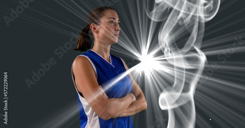 Composition of female basketball player with arms crossed with copy space
