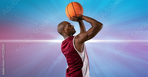 Composition of male basketball player holding basketball with copy space © vectorfusionart