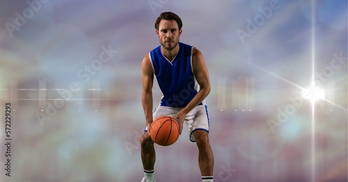 Composition of male basketball player holding basketball with copy space