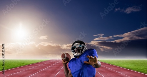 Composition of male american football player throwing ball over sports stadium