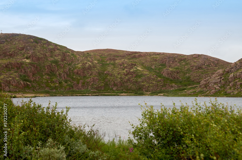 Summer landscape with lake, rocks and forest Summer landscape with lake, rocks and forest