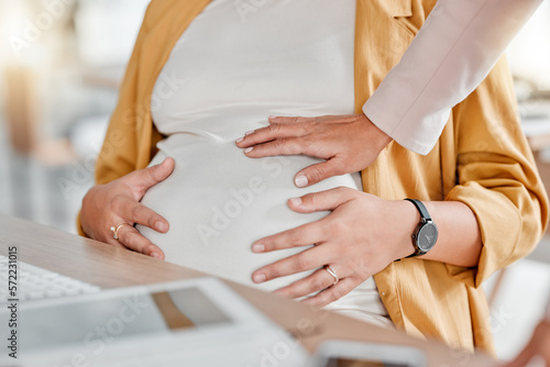 Pregnant woman, hand touch and stomach closeup of women in a office ready for work. Pregnancy, new mother and co working showing mama support by touching abdomen in the workplace with care and love