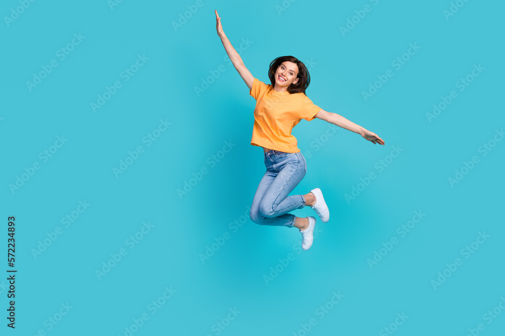 Full length photo of glad satisfied girlish pretty lady enjoy weekend holiday trip journey empty space isolated on blue color background