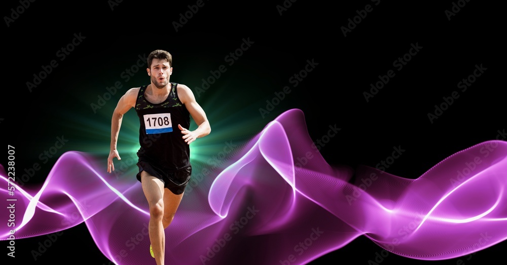 Composition of male athlete running with copy space and pink light trails Composition of male athlete running with copy space and pink light trails