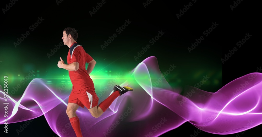 Composition of male rugby player running with copy space and pink light trails