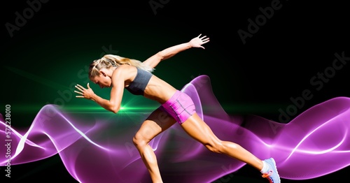 Fototapeta Naklejka Na Ścianę i Meble -  Composition of female athlete running with copy space and pink light trails
