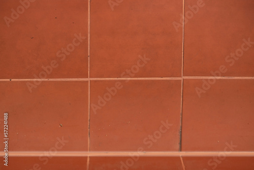 Brick orange wall tiles are square for installation spacing and beauty