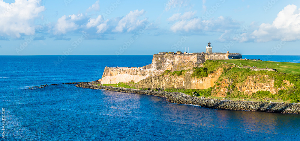 A view from the harbour entrance past fortifications in San Juan, Puerto Rico on a bright sunny day