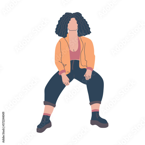 Young brunette woman sitting casually.