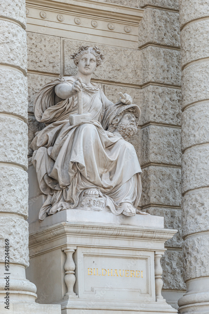 Vienna, Austria - Sculpture of powerful woman with hammer and severed head known as Bildhauerei located museums district, downtown in Vienna, Austria