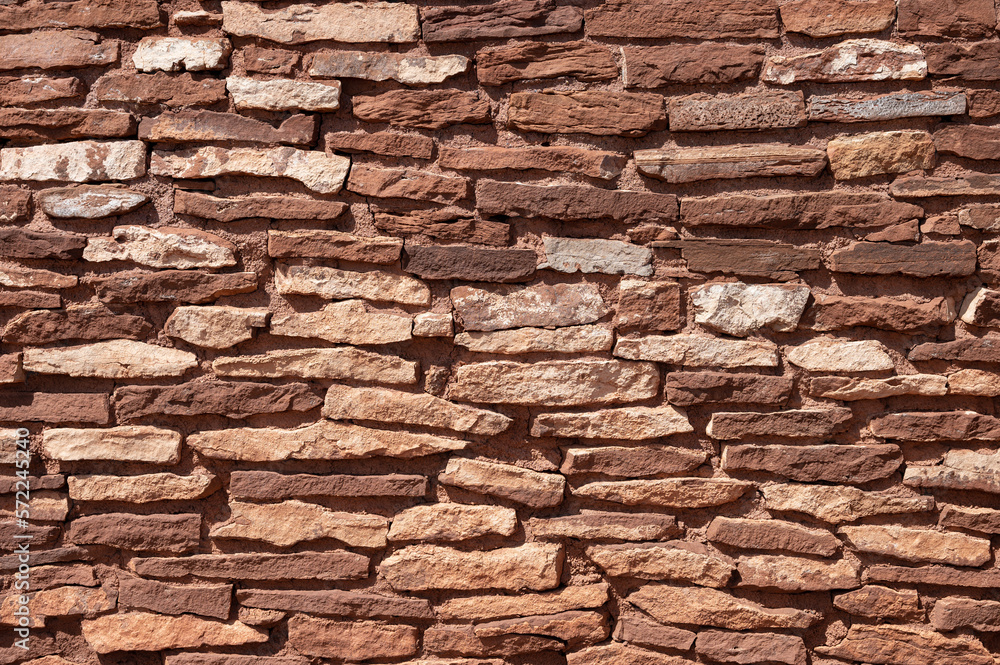 Obraz premium Detail of a brick and stone wall from the ancient Wupatki settlement, in Wupatki National Monument