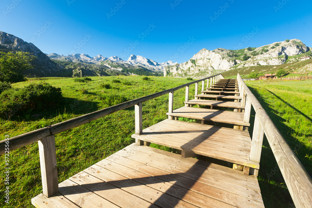 view with a wooden walkway to national park peaks of europe view with a wooden walkway to national park peaks of europe
