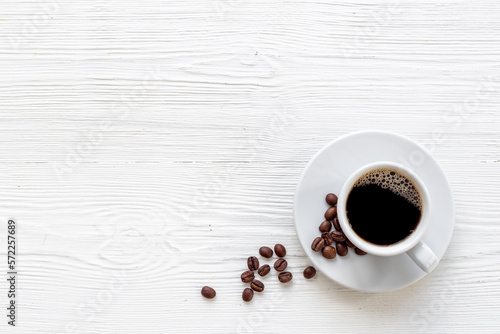 Black coffee - espresso - in white cup with coffee beans © 9dreamstudio