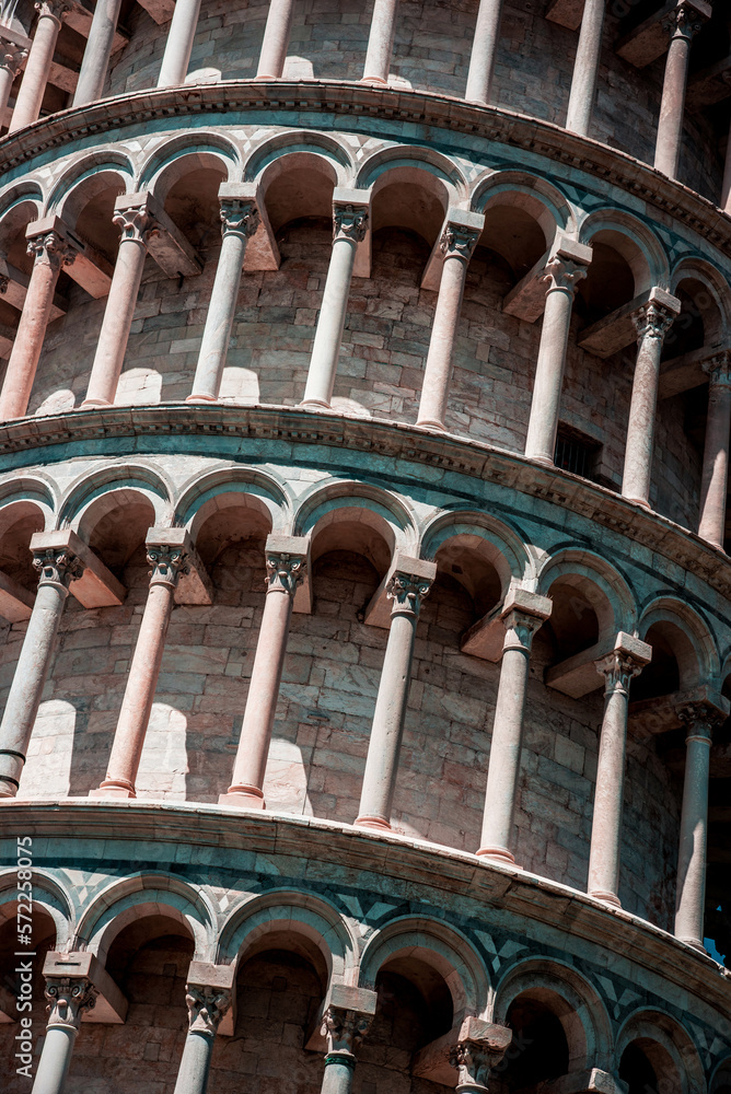 Texture fragment of the famous sloping tower with columns in Pisa, Italy. fascinating exotic amazing places.
