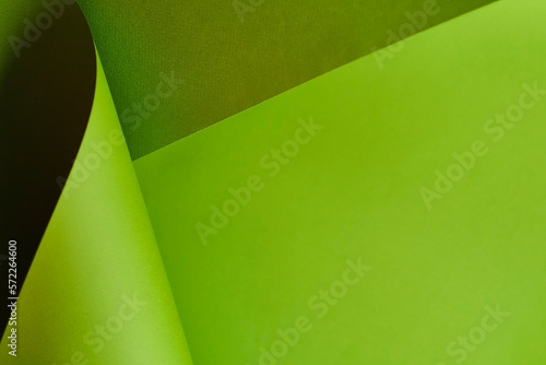 green background. curled sheet of paper. Abstract creative modern layout. Design element for advertising and promotional.