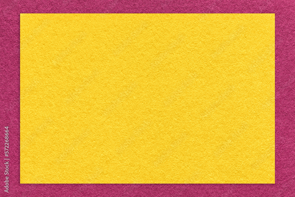 Texture of craft yellow color paper background with purple border, macro. Vintage dense kraft golden cardboard Texture of craft yellow color paper background with purple border, macro. Vintage dense kraft golden cardboard