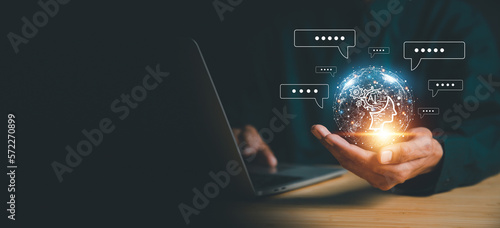 Chatbot chat AI concept, artificial intelligence Businessman using AI smart robot technology inputting commands to analyze data and build something. future technology changes.
