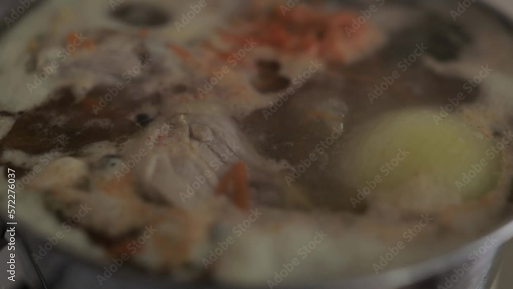 Soup with chicken meat and potatoes. Healthy food, chicken in a saucepan. light chicken soup in a saucepan is cooked on the stove. slow motion horizontal video Soup with chicken meat and potatoes. Healthy food, chicken in a saucepan. light chicken soup in a saucepan is cooked on the stove. slow motion horizontal video