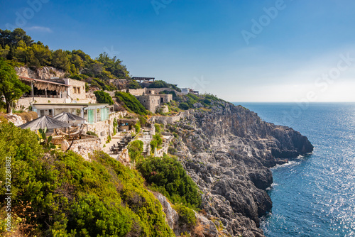 Ciolo bridge. An inlet of the sea, in Gagliano del Capo, near Santa Maria di Leuca. The panorama of the splendid coast of Salento, in Puglia. The rocky cliff and the restaurants overlooking the sea.