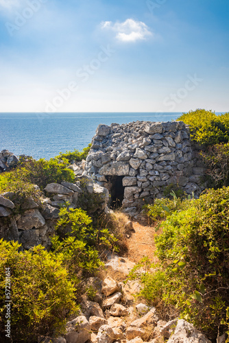 Gagliano del Capo. The beautiful panorama on the blue sea, from the rocky cliff of Salento. An old stone trullo. The nature trail that leads from the Ciolo bridge to the spectacular Cipolliane caves.