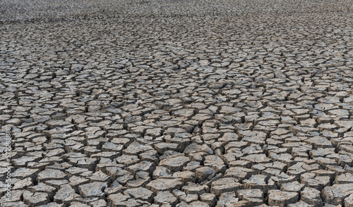 drought land.Land with dry and cracked desert ground, global warming background.Concepts global warming problem resolution with over cracks soil .